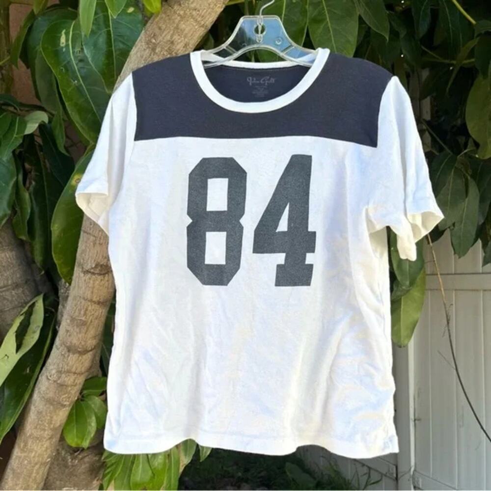 Brandy Melville John Galt 84 Graphic Navy and White Baby Tee.